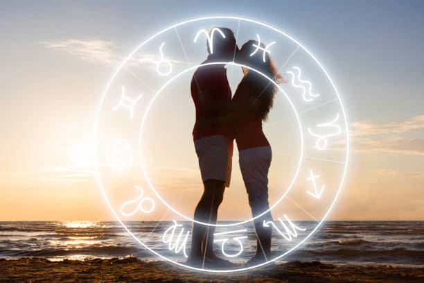 istock Couple Kissing At Beach During Sunset 1387867660