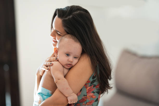 istock Mother comforting baby 1387868783