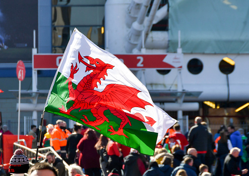 Flag of wales waving with highly detailed textile texture pattern