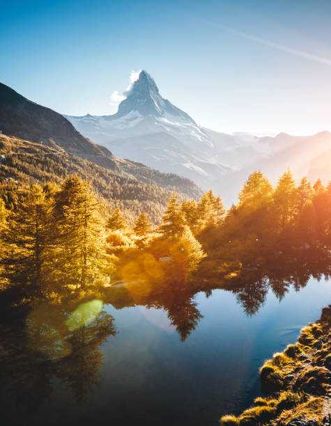 Amazing evening view of Matterhorn. Location Grindjisee lake, Cervino peak, Swiss alps, Europe. Majestic evening view of Matterhorn. Location Grindjisee lake, Cervino peak, Swiss valley, Europe. Scenic image of most popular tourist attraction. Splendid wallpapers. Discover the beauty of earth. autumn mountain landscape sunset stock pictures, royalty-free photos & images