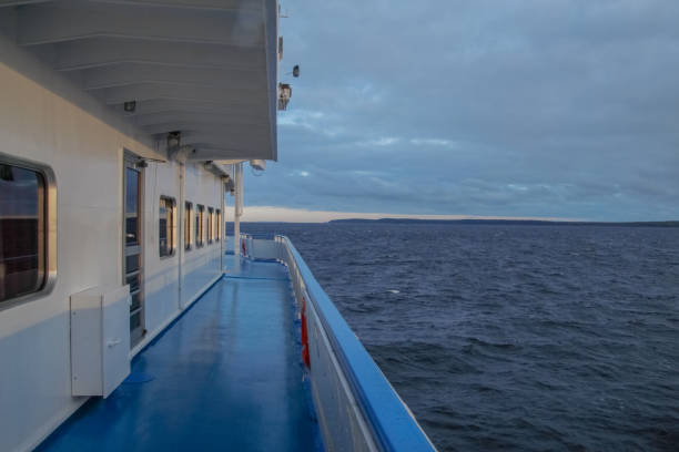 empty deck of a ship sailing on the sea stock photo