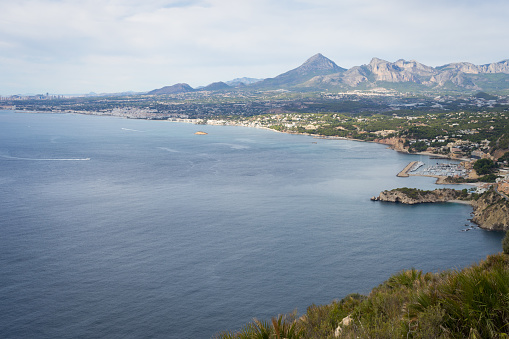view of the light blue mediterranean sea and beautiful mountain landscape, travel destination Costa Blanca Spain