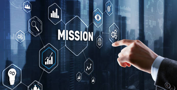 istock Businessman clicks on virtual screen Mission 1387876338