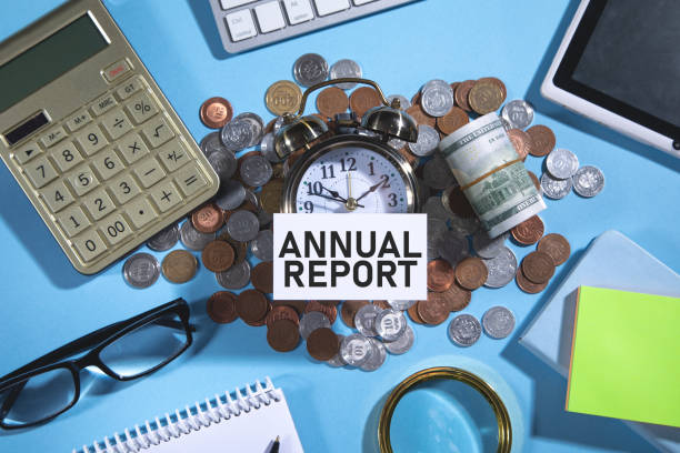 istock Annual Report on business card with a business objects. 1387881260