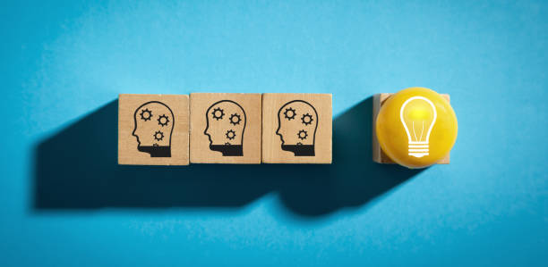 istock Light bulb and human head symbols. Idea. Creativity 1387881265