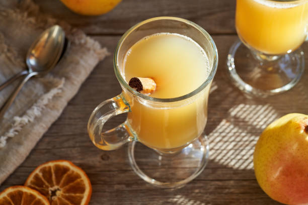 istock Hot pear drink on a wooden table 1387882173