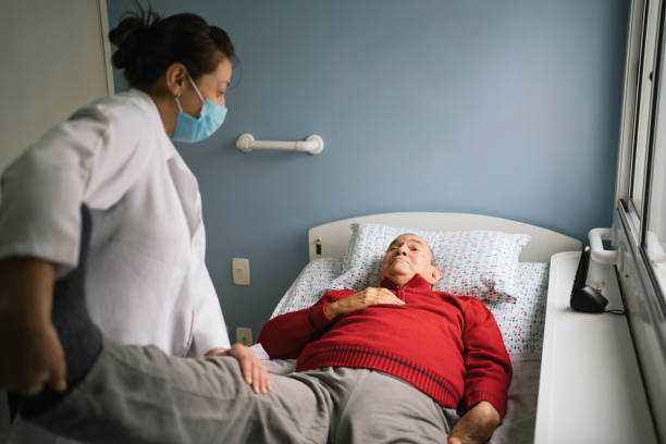 istock Senior man with stroke doing physical therapy at home 1387883180