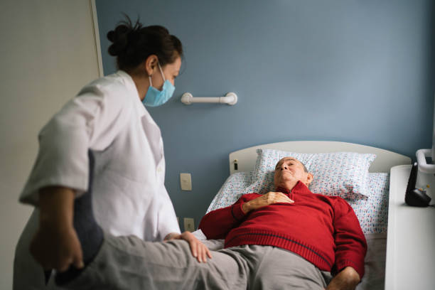 istock Senior man with stroke doing physical therapy at home 1387883182