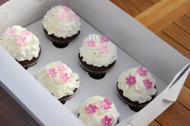 istock Cupcake with flowers design in box 1387892496