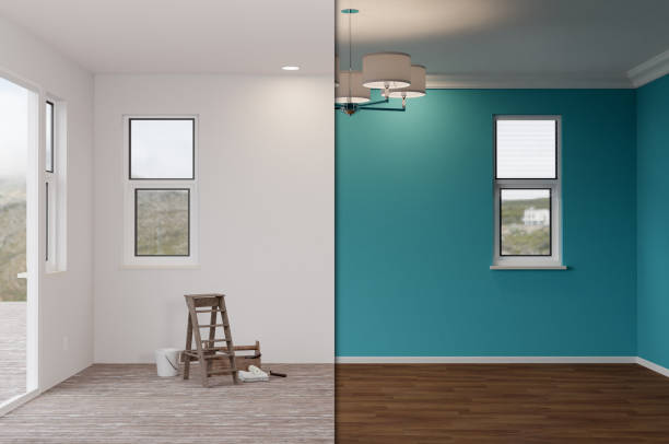 Unfinished Raw and Newly Remodeled Room of House Before and After with Wood Floors, Moulding, Rich Blue Paint and Ceiling Lights. stock photo