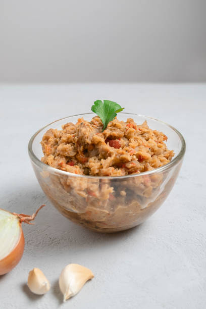 istock Vegetarian eggplant dip Kiopoolu in a glass jar on neutral background 1387898266