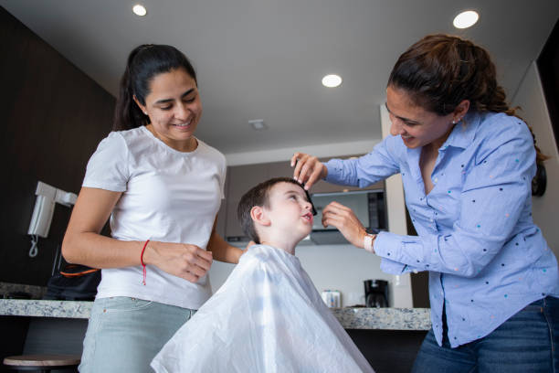 istock LGBT+ couple with child at home 1387898568