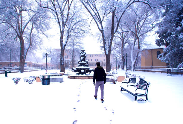 istock Santa Fe, NM: Cathedral Park in Fresh Snow, with Pedestrian 1387900266