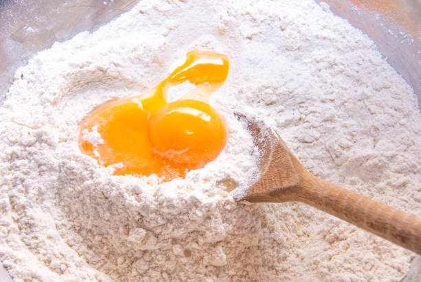 istock A pile of flour with an egg in the middle and a batch 1387900368