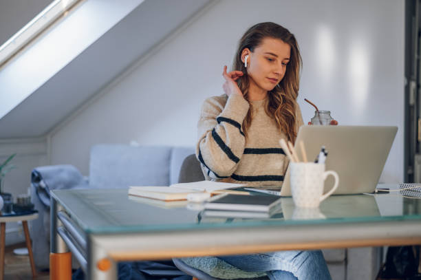 istock Woman working from a home on her a laptop 1387900939