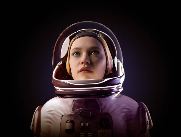 istock Female astronaut looking up. 1387908017