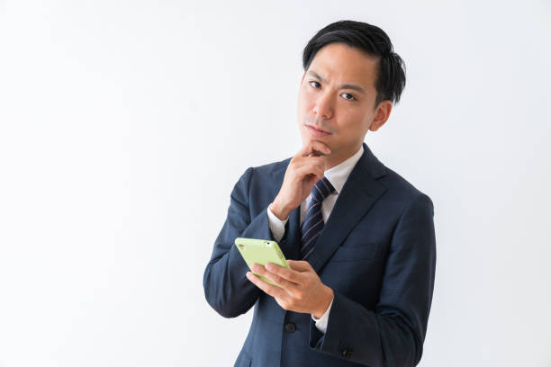 istock young businessman who uses smart phone,think, 1387910043
