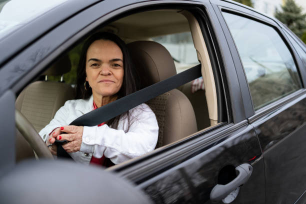 istock Confident latin woman with dwarfism driving 1387910733
