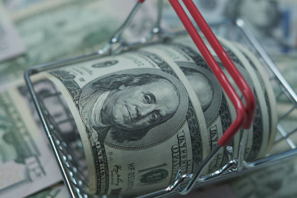 istock Dollars are in the grocery basket. 1387911704