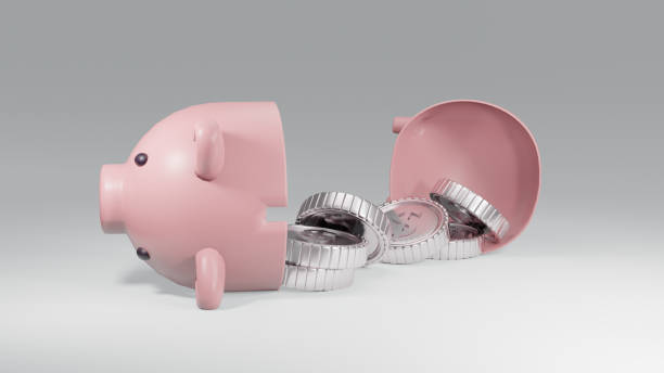 istock 3D Rendering concept of a broken piggy bank with silver coins on white background. 3D Render. 1387913793