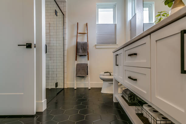istock Bathroom with dark hexagon tile flooring 1387917527