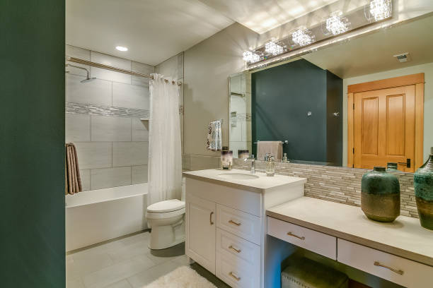 istock Good size bathroom with green accent wall 1387920589