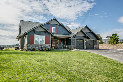 Front Exterior Brand New Trendy Upscale Home Ready for Sale on a Sunny Day