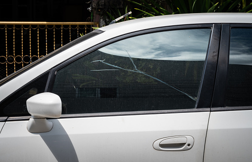 Close-up of damaged car windshield by hail