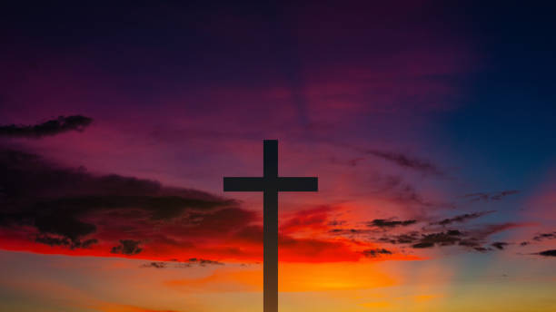 istock The Cross at the sunset background 1387929369