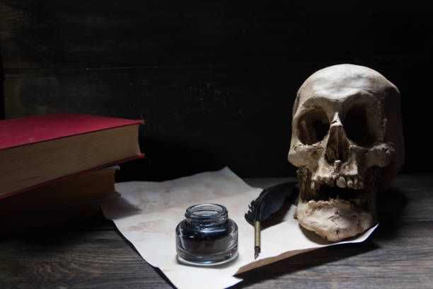 A close-up image of an artistic skull sculpture adorned with intricate detailing and golden accents, highlighting its craftsmanship and evoking a dark and mysterious atmosphere.