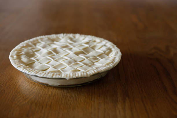 istock Homemade apple pie on a wooden table. Making apple pie. Space for copy. 1387931375