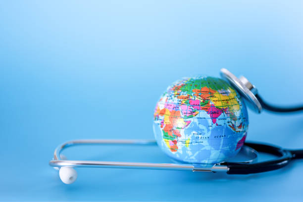 istock Stethoscope and planet earth on a blue background. Green Earth Day, 1387933104