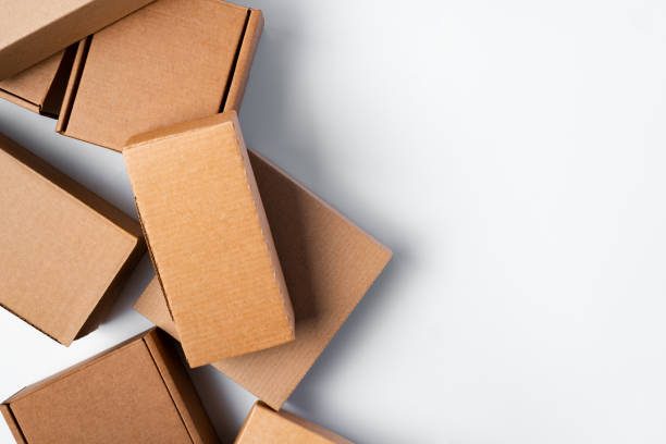 istock Lot of cardboard boxes on white background 1387938324