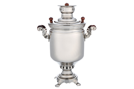 Silver Chrome Old Vintage metal Traditional Russian Teapot samovar isolated on white. Folk utensils for tea drinking, water boiler.