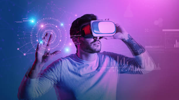 istock Modern man in VR glasses pressing button at virtual screen with futuristic graphs and charts, creative collage 1387941883