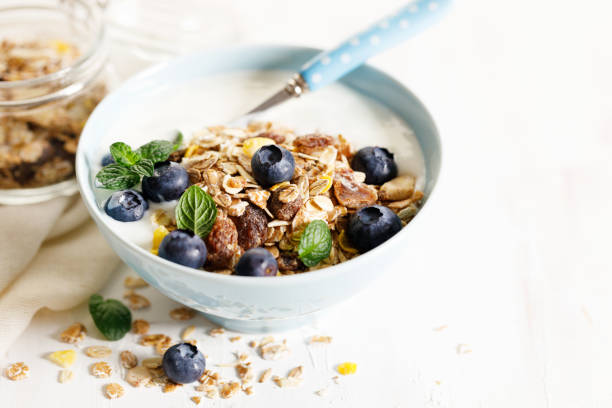 istock Healthy breakfast with yogurt, granola and fresh blueberries. 1387942576
