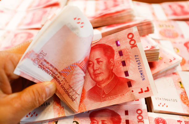 istock Bundles of Renminbi. 1387942652