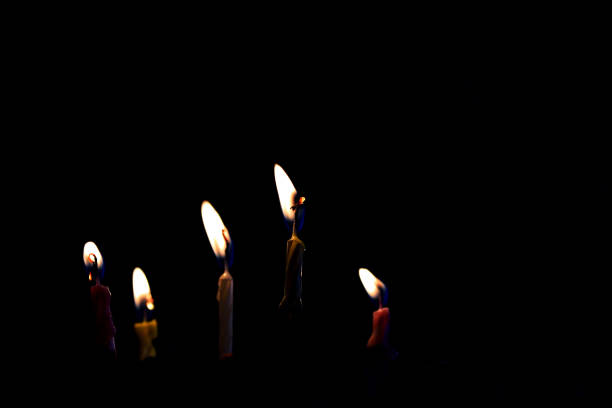 Burning candles in the darkness