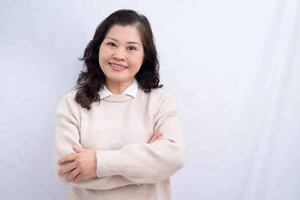 Photo of Portrait of senior Asian woman on white background