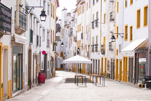 Street view with beautiful old residential buildings in the city of Evora, Portugal