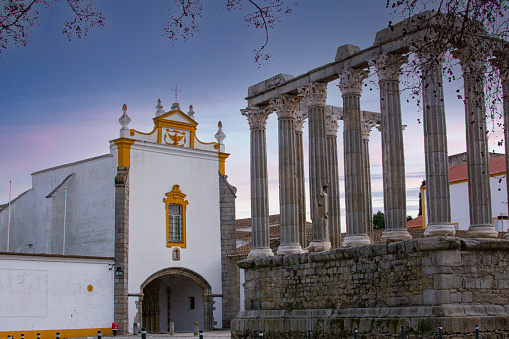 EVORA, PORTUGAL - february 26, 2022 : The Roman Temple of Evora or Templo romano de Evora, also referred to as the Templo de Diana is an ancient temple in the Portuguese city of Evora, Portugal
