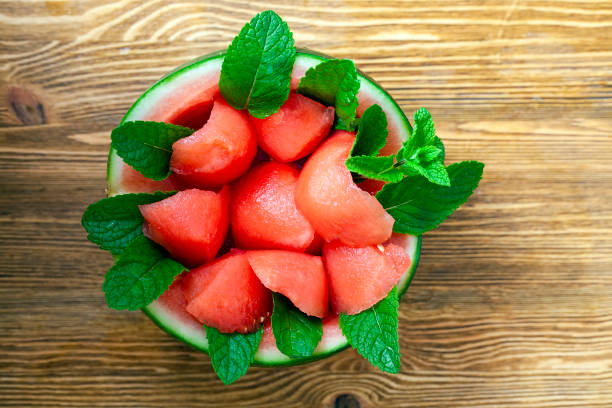 istock sliced ripe red watermelon with green fragrant mint 1387949512