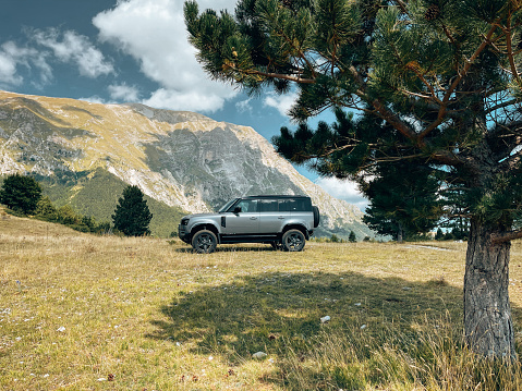 Castelluccio di Norcia, Italy - July 9th, 2020 : The New Land Rover Defender stationery in the hills