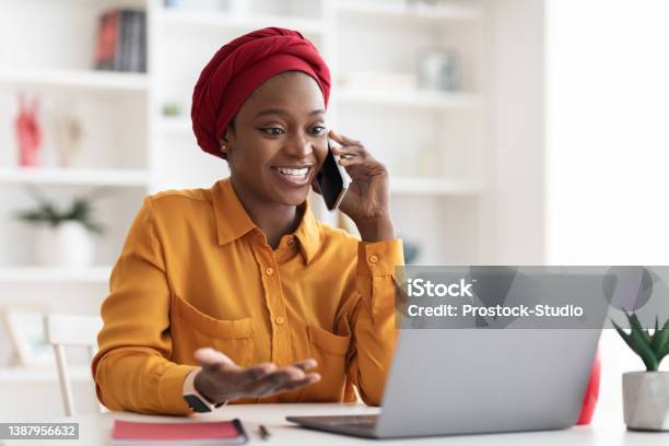 Positive Muslim Black Lady Working On Laptop At Office Stock Photo - Download Image Now