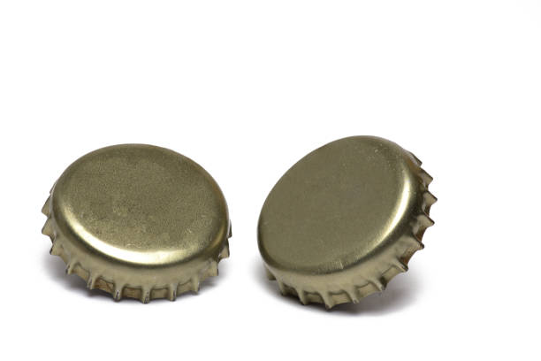 istock Closeup two golden crown corks slightly standing 1387961496