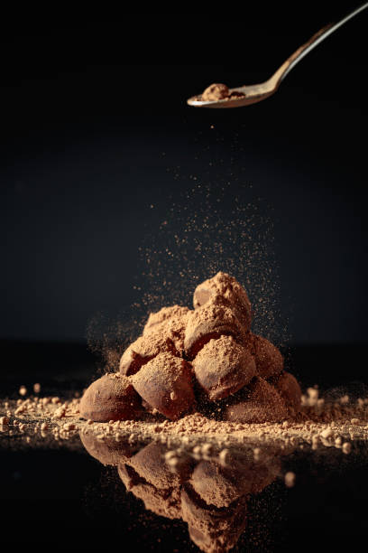 istock Chocolate truffles sprinkled with cocoa. 1387962750