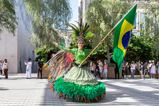Dubai, UAE - November 15, 2021: Brazilian dancer participates in Daily Parade at Expo 2020 in Dubai, cultural moving celebration. High resolution photo.