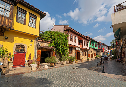 Antalya, Turkey - August 30, 2021: Traditional houses and buildings in the historic part of Antalya Kaleici, Turkey. Antalya Old town (Kaleici) is one of the most touristic places with its streets and culture in Antalya.