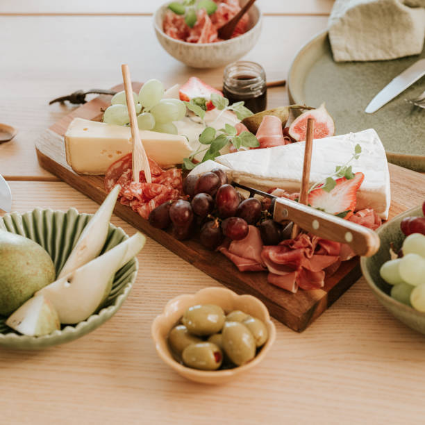 Cheese and meat cold cuts platter tapas food still life Cheese and meat cold cuts platter tapas food still life
Photo taken indoors in natural light plate fig blue cheese cheese stock pictures, royalty-free photos & images