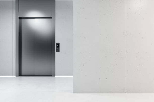 istock Modern concrete interior with elevators and mock up place on wall. Lift, lobby and start up concept. 3D Rendering. 1387970558